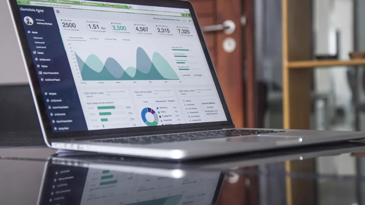 Laptop with financial dashboards on an accountant's desk