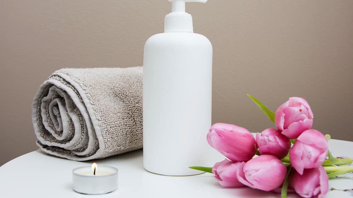 Spa still-life with towel, candle and flowers