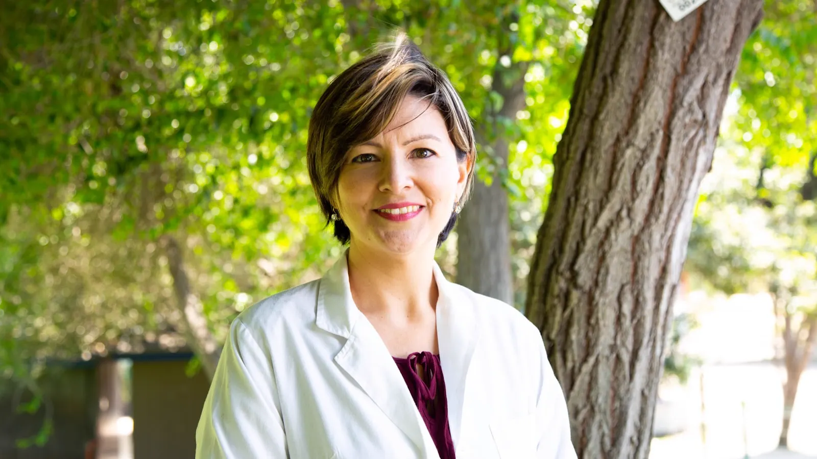 AI voice agent for medical practices: smiling doctor in a white coat