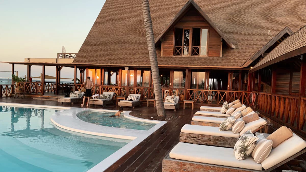 Resort hotel with pool at sunset