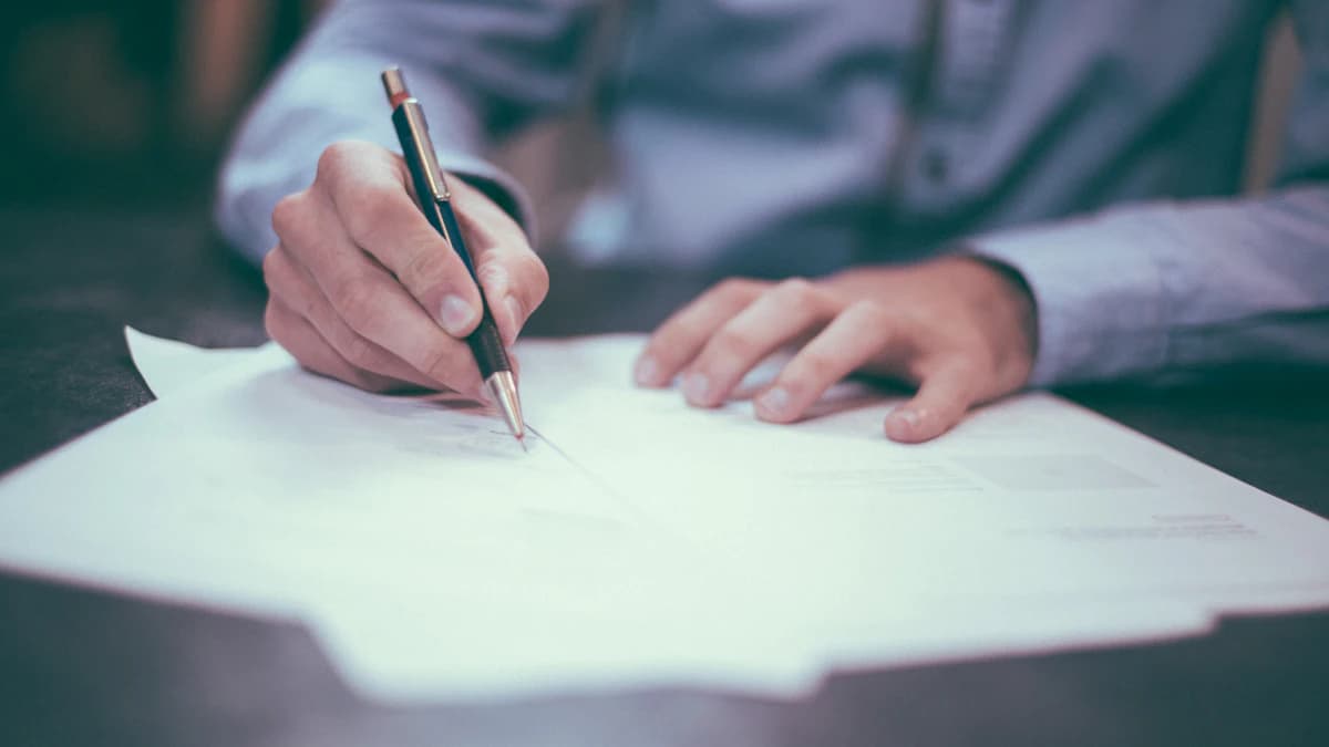 Signing an insurance contract at a desk