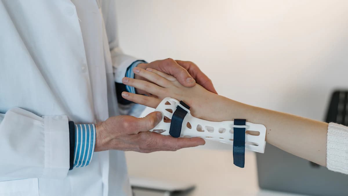 Physiotherapist fitting a wrist splint on a patient