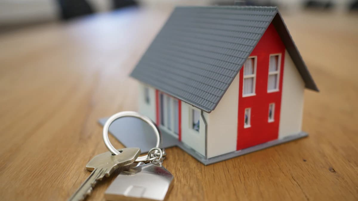 Miniature house with keys, property purchase