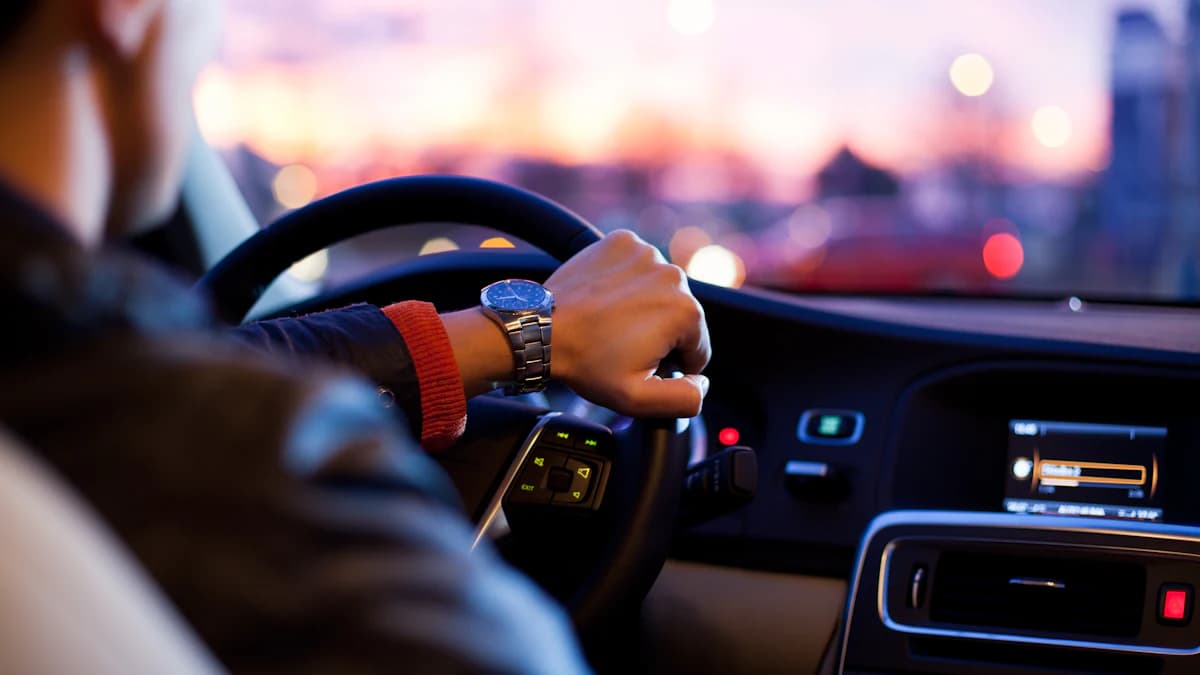 Driver at the wheel of a car in the city