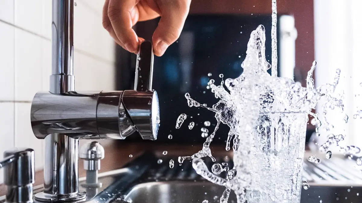 Plumber checking a kitchen tap with running water